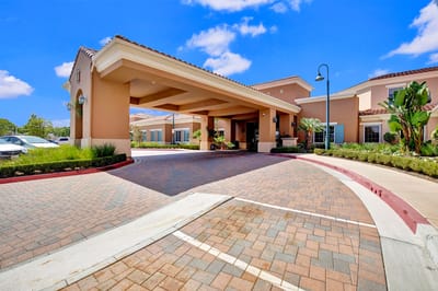 Front entrance of GlenBrook Health Center with paving and landscaping