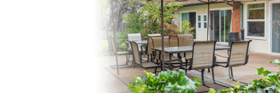 Outdoor seating area with tables and chairs