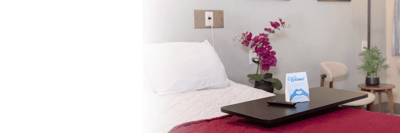 Cozy resident room with a welcome sign and floral decor