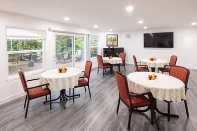 Bright common area with tables and chairs