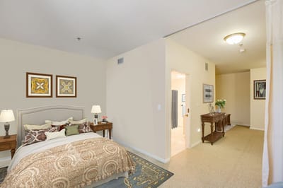 A well-furnished resident room with decor