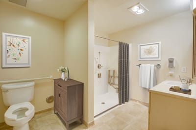 Clean and well-decorated bathroom in a resident room