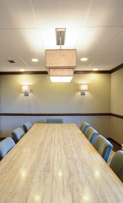 Interior meeting room with large table and lighting