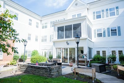 Outdoor area of the facility with seating and gardens