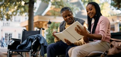 Resident enjoying an outdoor moment with a caregiver