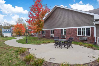 Outdoor seating area with fall foliage