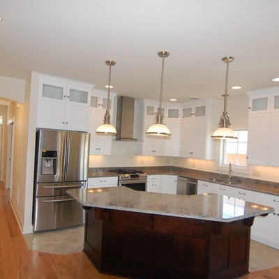 Modern kitchen with white cabinetry and granite countertops