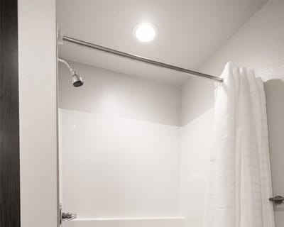 Simple shower area with curtain and showerhead