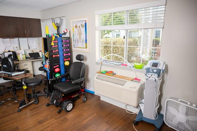 Rehabilitation equipment in a well-lit therapy room