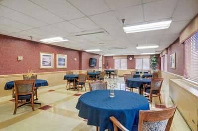 Interior view of a common area with tables and chairs