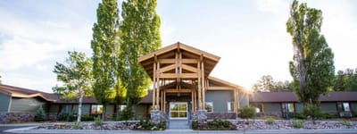 Exterior view of the nursing home with landscaped entrance