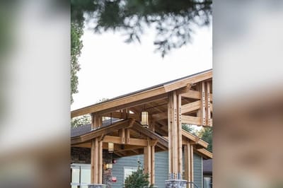 Exterior view of a building entrance with wooden architecture
