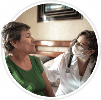 Healthcare worker interacting with a senior resident
