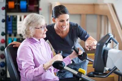 Resident engaging in therapy with staff support
