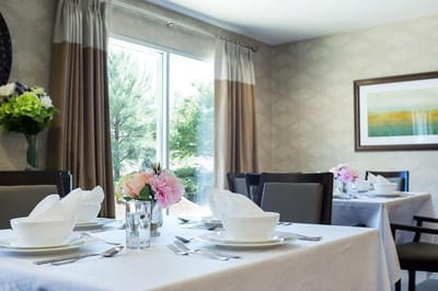 Beautifully set dining table with floral arrangements