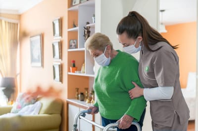A caregiver assisting a resident in a facility.