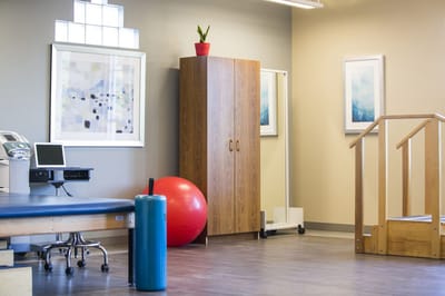 Interior therapy room with exercise equipment and decor