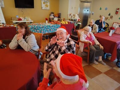Residents engaged in a festive activity indoors
