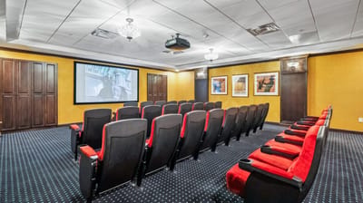 Interior of a movie theater room with seating