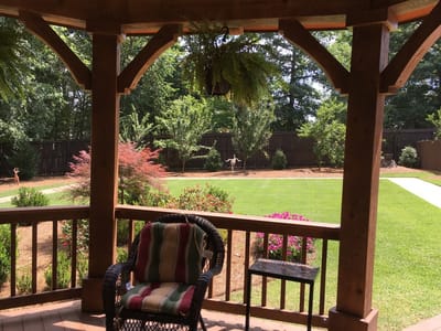 Relaxing outdoor space with seating and garden view