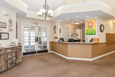 Bright lobby area with reception desk and seating