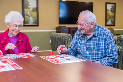 Residents enjoying a game of bingo in a common area