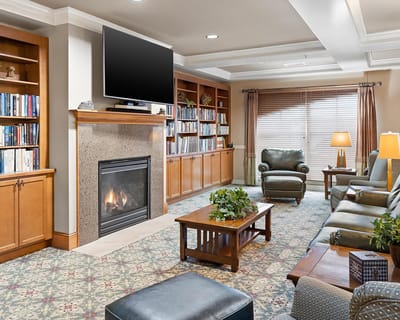 Common area with bookshelves and seating