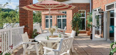 Outdoor patio area with seating and umbrellas