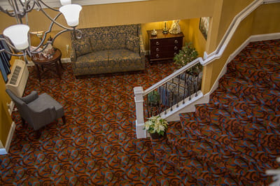 Interior view of a cozy common area with stairs