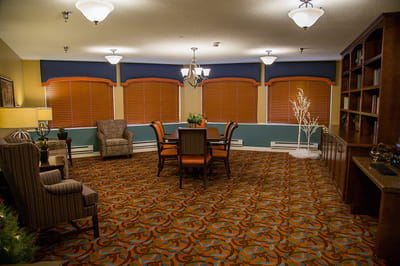 Bright common area with seating and a dining table