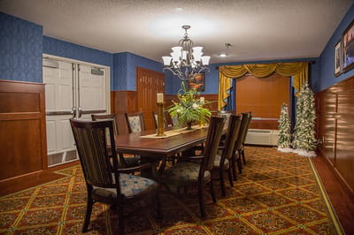 Well-decorated dining room with large table and chairs