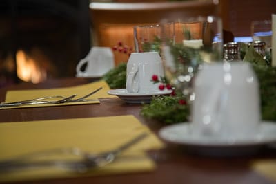 Dining table set with festive decorations and tableware