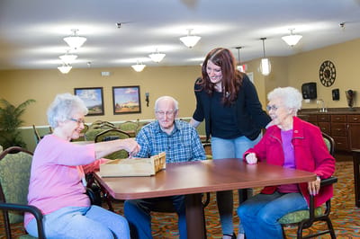 Residents and staff engaging in a social activity