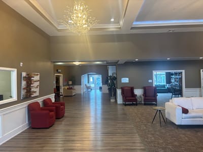 Interior view of a community lounge area with seating