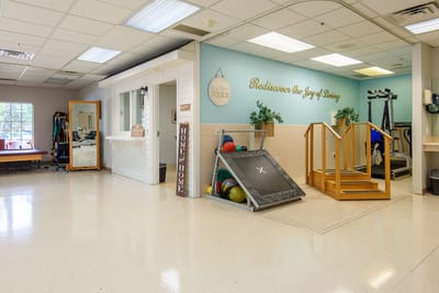 Interior exercise area with equipment and positive signage