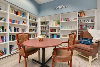 Bright common area with bookshelves and seating