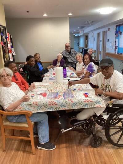 Residents participating in a group activity at a table
