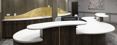 Modern reception area with curved counters and decor