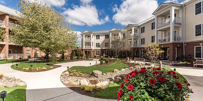 Outdoor area with gardens and building facade