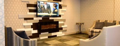 Cozy common area with seating and a TV