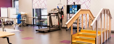 Interior view of a therapy gym with equipment