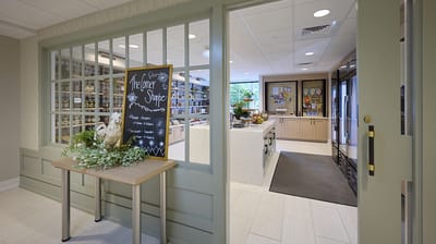 Interior view of a kitchen space with a chalkboard menu