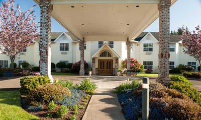 Entrance of Lakeview Senior Living surrounded by gardens