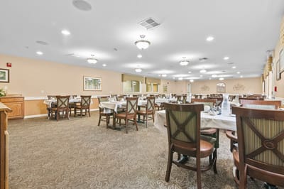 Dining room with tables set for residents
