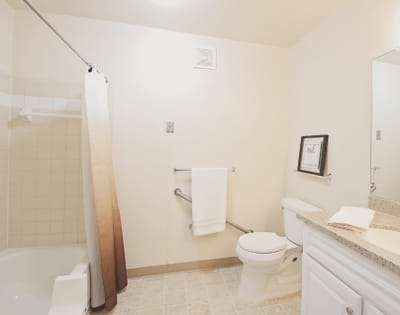 A well-lit bathroom with safety features