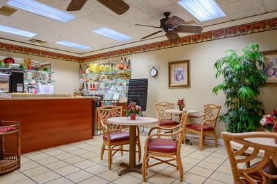 Cozy dining area with tables and flowers