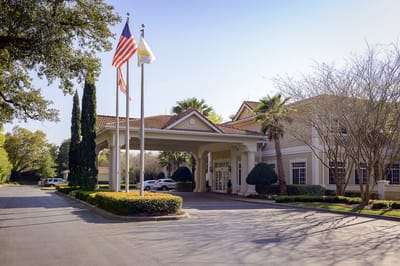 Entrance of Life Care Center of Pensacola with flags