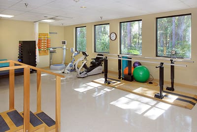 Fitness and therapy room with equipment and exercise aids