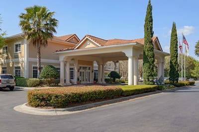 Exterior view of Life Care Center of Pensacola with landscaping