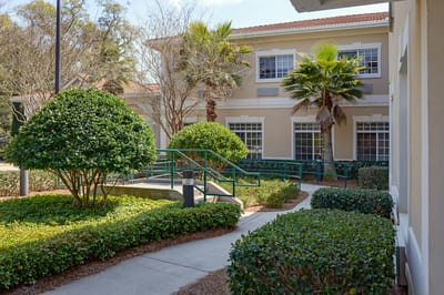 Outdoor pathway leading to the facility entrance